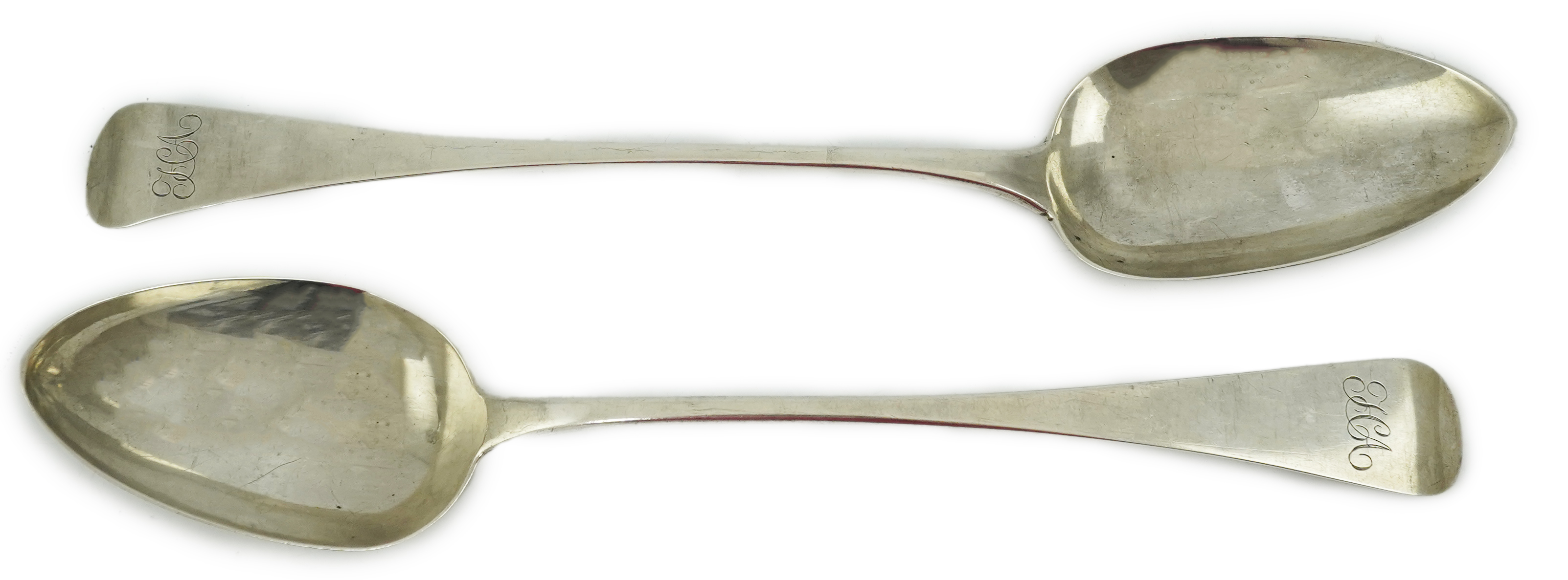 A George III provincial silver Old English pattern basting spoon by George Murray, Newcastle, 1824, 30.3cm, together with a similar George IV provincial silver basting spoon, by Barber, Cattle & North, York, 1827, 29cm